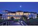 Elegant home exterior at night with bridge view at 1227 Osowaw Blvd, Spring Hill, FL 34607