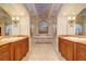 Large bathroom with and sinks, a soaking tub, and marble flooring at 1227 Osowaw Blvd, Spring Hill, FL 34607