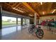 Spacious basement garage with high ceilings, open to a scenic backyard at 1227 Osowaw Blvd, Spring Hill, FL 34607