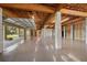 Unfinished basement garage with high ceilings and multiple garage doors at 1227 Osowaw Blvd, Spring Hill, FL 34607