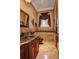 Elegant bathroom with granite countertop and custom cabinetry at 1227 Osowaw Blvd, Spring Hill, FL 34607