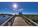 Wooden footbridge over tranquil water leading to scenic views at 1227 Osowaw Blvd, Spring Hill, FL 34607
