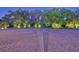 Brick paver driveway with compass rose design and lush landscaping at 1227 Osowaw Blvd, Spring Hill, FL 34607