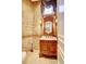 Powder room with ornate vanity and decorative wall accents at 1227 Osowaw Blvd, Spring Hill, FL 34607