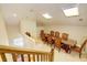 Charming dining area with skylights and a glass-top table at 1227 Osowaw Blvd, Spring Hill, FL 34607