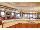 Kitchen features granite countertops, custom cabinetry, and breakfast bar at 1227 Osowaw Blvd, Spring Hill, FL 34607