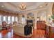 Relaxing main bedroom with sitting area, fireplace, and hardwood floors at 1227 Osowaw Blvd, Spring Hill, FL 34607