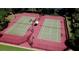 Two lighted tennis courts with a basketball hoop at 1227 Osowaw Blvd, Spring Hill, FL 34607