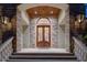 Grand entryway with double doors and stonework at 1227 Osowaw Blvd, Spring Hill, FL 34607