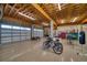 Finished basement garage with high ceilings, storage and exercise equipment at 1227 Osowaw Blvd, Spring Hill, FL 34607