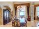 Formal dining room with a large table, hardwood floors, and stunning water views at 1227 Osowaw Blvd, Spring Hill, FL 34607