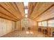Spacious game room with wood walls and ceiling, hardwood floors, and large windows at 1227 Osowaw Blvd, Spring Hill, FL 34607
