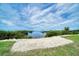 Seashell path leads to waterfront with calm water and blue sky at 1227 Osowaw Blvd, Spring Hill, FL 34607