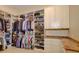 Large walk-in closet with ample shelving and hanging space at 1227 Osowaw Blvd, Spring Hill, FL 34607