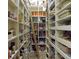Walk-in pantry with ample shelving for storage at 1227 Osowaw Blvd, Spring Hill, FL 34607