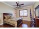 Spacious bedroom with hardwood floors, a comfortable bed, and plenty of natural light at 1227 Osowaw Blvd, Spring Hill, FL 34607