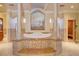 Spa-like bathroom with large soaking tub, a sauna, and marble accents at 1227 Osowaw Blvd, Spring Hill, FL 34607