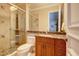 Clean bathroom with granite countertop, walk-in shower and wood cabinets at 1227 Osowaw Blvd, Spring Hill, FL 34607