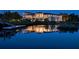 Luxury home reflecting in the water at night at 1227 Osowaw Blvd, Spring Hill, FL 34607