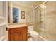 Updated bathroom with granite countertop, walk-in shower and wood cabinets at 1227 Osowaw Blvd, Spring Hill, FL 34607