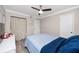 Bedroom with ceiling fan, dresser, and blue bedding at 360 N Bayshore Blvd # 106, Clearwater, FL 33759