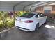 White Ford Fusion parked under carport at 1401 W Spencer St, Plant City, FL 33563
