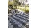 Hexagonal patio with seating area, lush landscaping, and a tranquil view at 1401 W Spencer St, Plant City, FL 33563