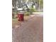 Trash can and surrounding landscaping in the front yard at 1401 W Spencer St, Plant City, FL 33563
