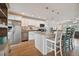 Modern kitchen island with granite countertops and seating, stainless steel appliances at 11600 7Th E St, Treasure Island, FL 33706