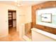 Stylish bathroom boasts a tiled shower, modern fixtures, and an open doorway to closet at 10799 Harborside Dr, Largo, FL 33773