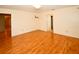 Bright bedroom with hardwood floors and a view of the entry and closet at 10799 Harborside Dr, Largo, FL 33773