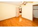 Bright bedroom featuring hardwood floors and a view to the kitchen at 10799 Harborside Dr, Largo, FL 33773
