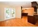Spacious and bright area with hardwood floors, access to the backyard and kitchen at 10799 Harborside Dr, Largo, FL 33773