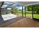 Charming screened patio with pond views and well maintained wood flooring at 10799 Harborside Dr, Largo, FL 33773