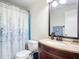 Clean and bright bathroom with a shower/tub combo and updated vanity at 180 Altoona Nw St, Port Charlotte, FL 33948