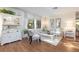 Living room with white furniture and hardwood floors, near lake at 2585 Bay Berry Dr # 43D, Clearwater, FL 33763