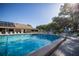 Community pool with ample deck space and lounge chairs at 2585 Bay Berry Dr # 43D, Clearwater, FL 33763