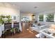 Open dining area with hardwood floors and access to living room at 2585 Bay Berry Dr # 43D, Clearwater, FL 33763