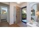 Bright and airy entryway with wood floors and view into bathroom at 2585 Bay Berry Dr # 43D, Clearwater, FL 33763