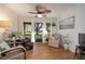 Relaxing living room with comfy seating, large window, and wood floors at 2585 Bay Berry Dr # 43D, Clearwater, FL 33763