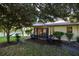 Relaxing patio with seating, overlooking a serene lake at 2585 Bay Berry Dr # 43D, Clearwater, FL 33763