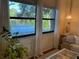 Living room with lake view, featuring comfy couch and decor at 2585 Bay Berry Dr # 43D, Clearwater, FL 33763