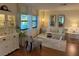 Bright living room with white furniture and hardwood floors at 2585 Bay Berry Dr # 43D, Clearwater, FL 33763