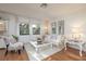 Living room with white furniture and hardwood floors, near lake at 2585 Bay Berry Dr # 43D, Clearwater, FL 33763