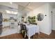 Bright dining area with kitchen view, table set for four, and wood flooring at 2585 Bay Berry Dr # 43D, Clearwater, FL 33763