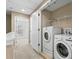 Bright laundry room featuring a stacked washer and dryer and extra storage space at 3201 W Horatio St # A, Tampa, FL 33609