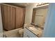 Cozy bathroom features a shower-tub combo and granite vanity at 6177 Sun Blvd # 108, St Petersburg, FL 33715