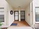 Inviting entryway with tiled floor, featuring door numbers 107 with wreath and 108, creating a welcoming entrance at 6177 Sun Blvd # 108, St Petersburg, FL 33715