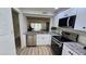 Beautiful kitchen overlooking the living room and water views at 6177 Sun Blvd # 108, St Petersburg, FL 33715