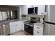 Remodeled kitchen with stainless appliances and granite counter tops at 6177 Sun Blvd # 108, St Petersburg, FL 33715
